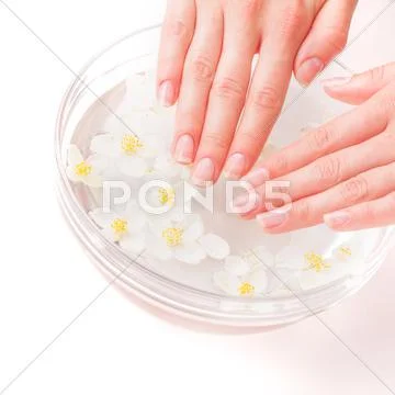 Woman hands in bath with water Stock Photos