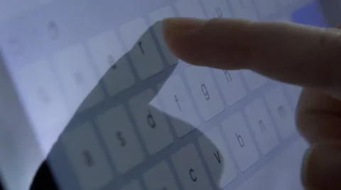 Woman hands composing text using the touchscreen of a tablet computer Stock Footage 60575174