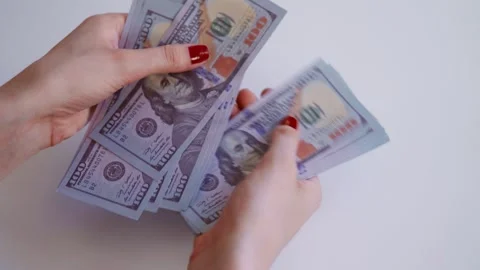 Woman hands counting stack of one hundred dollar bills. Stock Footage 338337185