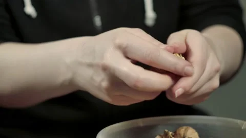 Woman Hands Cracking Walnuts With A Nutcracker Stock Footage 151350307