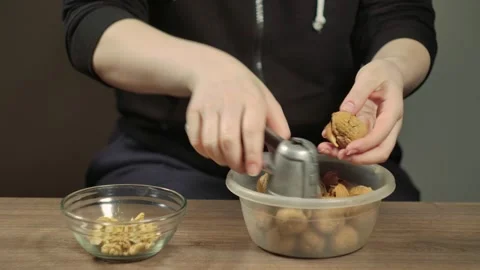 Woman Hands Cracking Walnuts With A Nutcracker Stock Footage 151350330