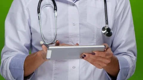 Woman hands doctors work on the tablet pc. Close up Stock Footage 70223153