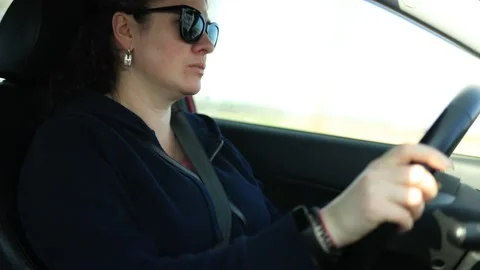 Woman Hands Drive A Car, Fingers Lie On  