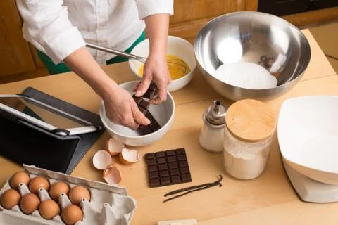 Woman hands  make a chocolate cake Stock Photos