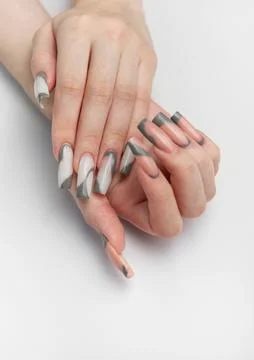 Woman hands with modern gray nail art design Stock Photos