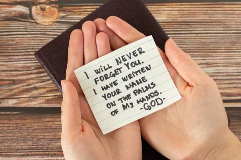 Woman hands palms holding a handwritten note Bible quote biblical concept Stock Photos