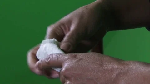 Woman hands playing with a tissue Stock Footage