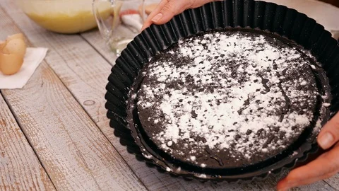 Woman hands preparing the baking pan to make a cake - slow motion 動画素材 101863569