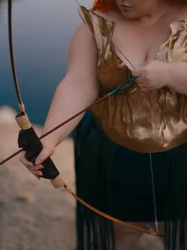 Woman Hands Pulling Bowstring With Arrow Close Up Stock Photos