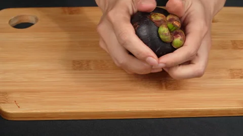 Woman Hands Squeezing Open Fresh Ripe Mangosteen Fruit Stock Footage 336230675