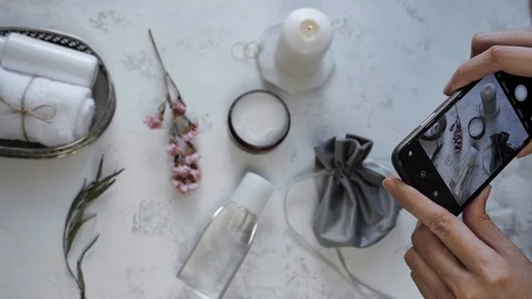 Woman Hands Takes Photo Of product layout On Table With Phone. Smartphone Photo Stock Footage
