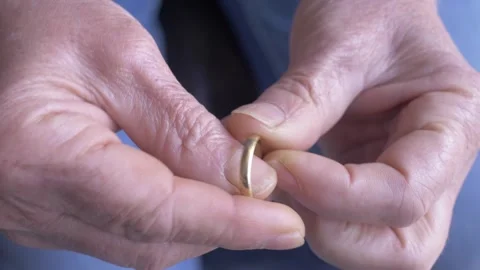 Woman hands touching nostalgic ring filled with personal memories Stock Footage 334774680