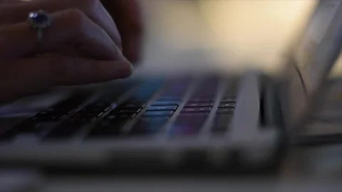 Woman Hands Typing On A Computer Keyboard. Mac Air. Slow motion. Stock Footage 125870445