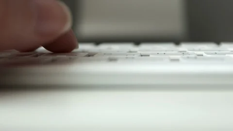 Woman hands typing on computer keyboard with selective focus, close-up Stock Footage 129561401