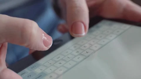 Woman hands typing on digital tablet screen close up Video stock 333837645