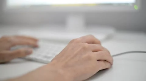 Woman hands using computer mouse and typing on a keyboard. Stock Footage 49416780