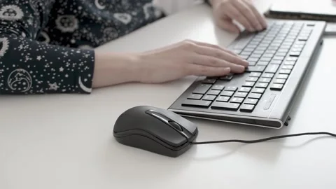 Woman hands using computer mouse and keyboard. Stock Footage 153150136