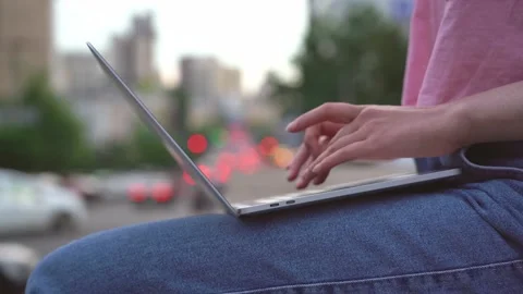 Woman hands using laptop computer, typing outdoors. Copywriter working online 库存影片 157216965