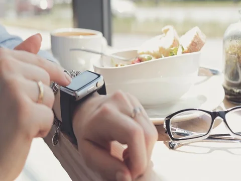 Woman Hands Using Smart Watch in a Cafe, Close Up. 4K SLOW MOTION DCi 動画素材 79365628