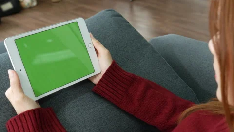 Woman hands using smartphone digital tablet empty blank green screen Stockbeeldmateriaal 274628090
