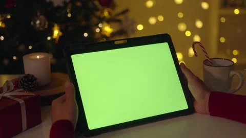 Woman hands using tablet with green screen in Christmas New Year at home. Vie Stock Footage 221421501
