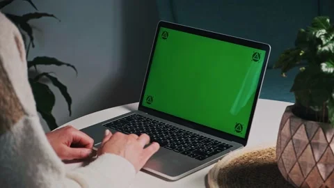 Woman hands Using touchpad Chroma key green screen laptop computer on desk at Stock Footage 168948229