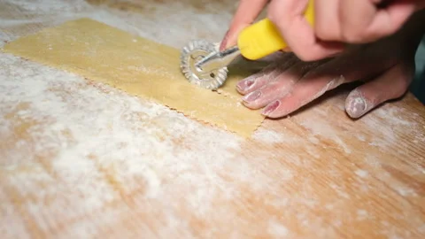 Woman hands while preparing sweets pastry in kitchen,homemade food,lockdown Stock Footage 147750375