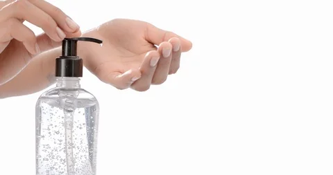 Woman hands White background hand sanitizer dispenser alcohol gel coronavirus Stock Footage