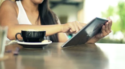 Woman hands working with tablet computer in cafe HD Stock Footage 53140875