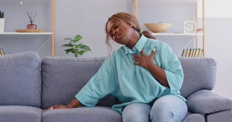 Woman has difficulty breathing with stuffy air, cant inhale and starts Stock Footage 289611032