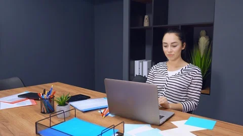 Woman has a video call using her laptop Stock Footage 107399933