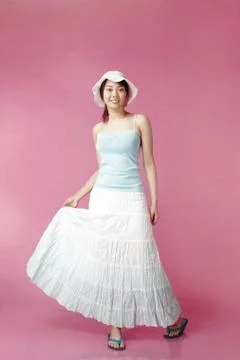 Woman with hat posing for the camera Stock Photos