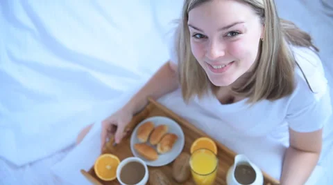 Woman having breakfast in bed Stock Footage 59220043