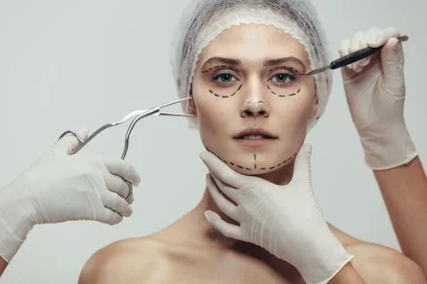 Woman having cosmetic face surgery Stock Photos
