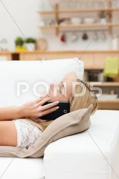 Woman having an enjoyable chat on her mobile Stock Photos