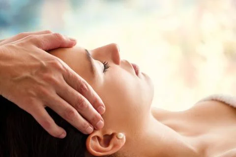 Woman having facial massage. Stock Photos