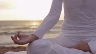 Woman Having Meditation Near The Sea: Practicing Yoga On The Beach Stock Footage
