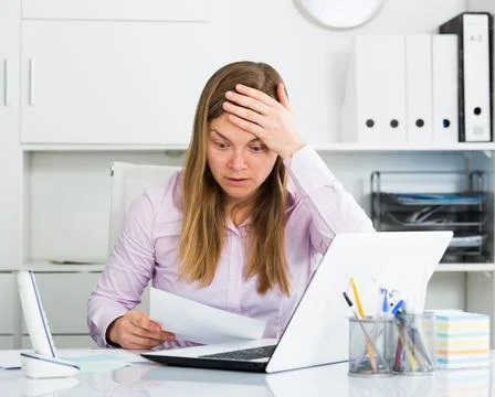 Woman having problem in office Stock Photos