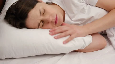 Woman having problems with her sleep, unable to fall asleep, feels headache Stock Footage 139397433