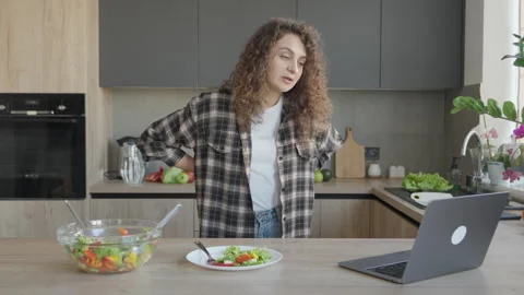 Woman Having Video Call While Working On Laptop In Modern Home Kitchen Stock-Footage 318957471