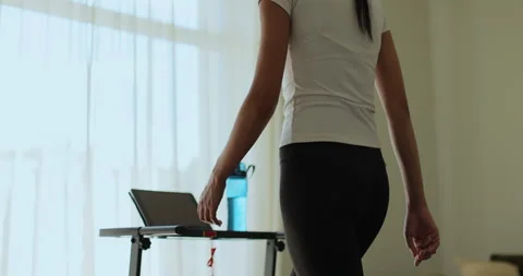 Woman having workout on treadmill back view. Fitness, girl and walking Stock Footage 336633809