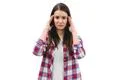 The woman with a headache standing on the white background Photo