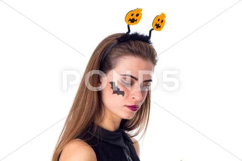 Woman with headband looking down Stock Photos