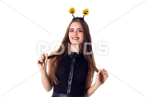 Woman with headband touching her hair Stock Photos