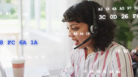 Woman on headset taking tech call, leaning and typing while hex code overlaying Stock Footage 333670934