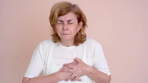 Woman with heart attack Stock Footage 83101064
