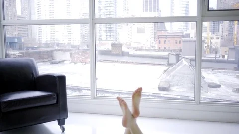 Woman in her 30s inside a modern condominium in downtown toronto (canada) Stock Footage