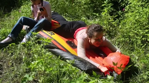 Woman with her daughter is deflated rubb... | Stock Video | Pond5