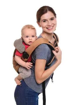 Woman with her son in baby carrier on white background Stock Photos