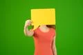 The woman hide her face by dialog sign on the green background Photo